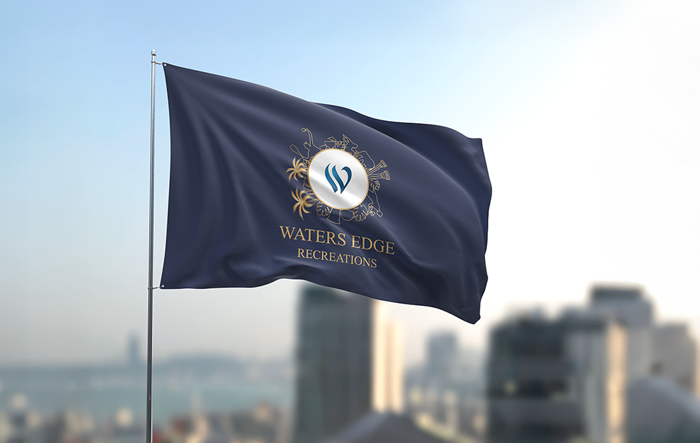 Waters Edge Recreations recreation logo design — navy flag with gold and white circular emblem and wordmark flying on a flagpole against a blurred Colombo city skyline